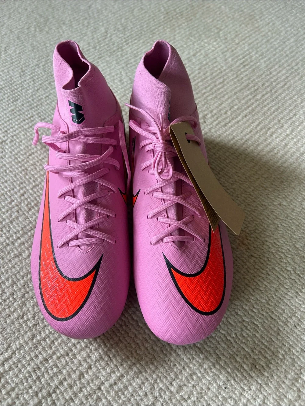 Nike Women’s Pink Sneakers with Orange Swoosh